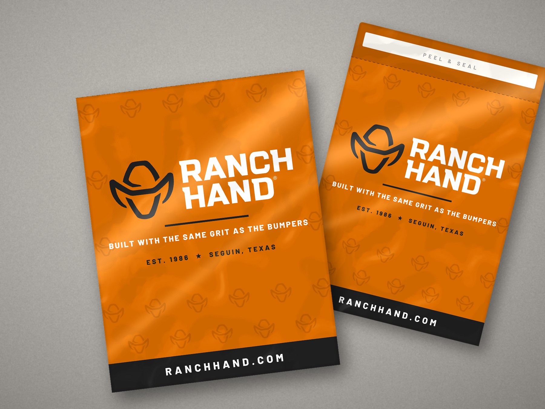 Two Ranch Hand orange poly mailers on a table, one sealed and one with the peel-and-seal flap open
